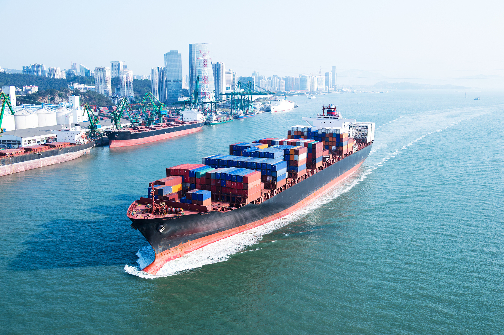 Cargo ship and airplane representing DDP shipping options from China